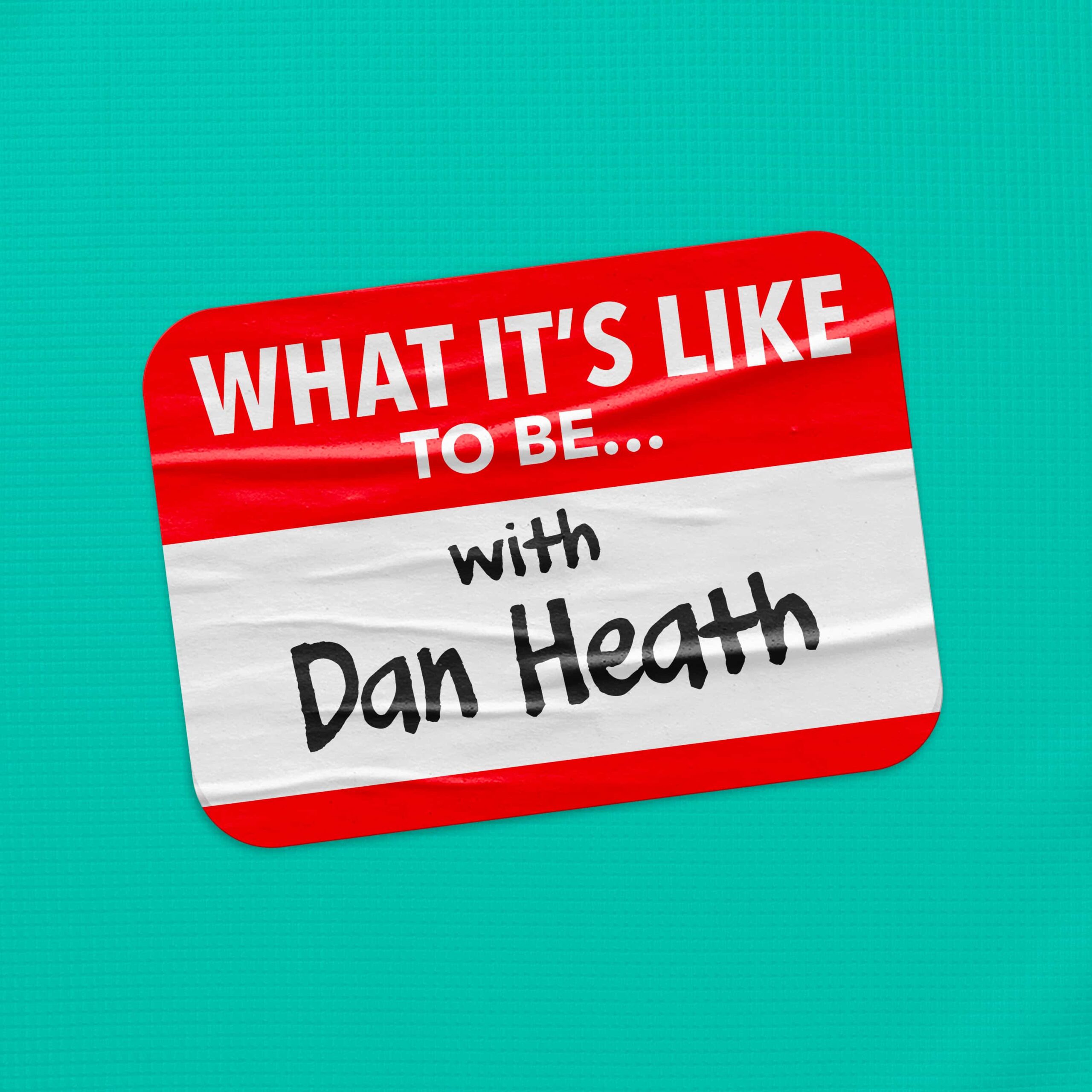 A red and white name tag with the text "WHAT IT'S LIKE TO BE..." at the top and "with Dan Heath" handwritten below.